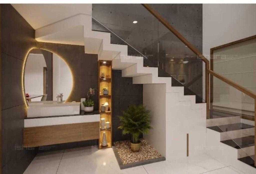 baño con escalera, bañera y lavamanos en The Serenity Suites, en Trivandrum