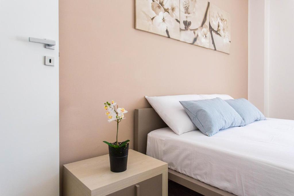Postel nebo postele na pokoji v ubytování Politeama Luxury Suites