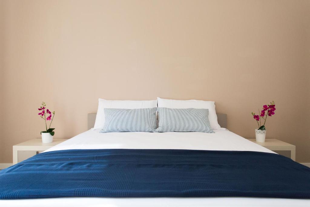 Postel nebo postele na pokoji v ubytování Politeama Luxury Suites