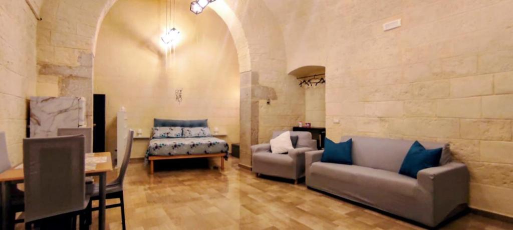 Postel nebo postele na pokoji v ubytování Dimora Pietra e Mare Trani