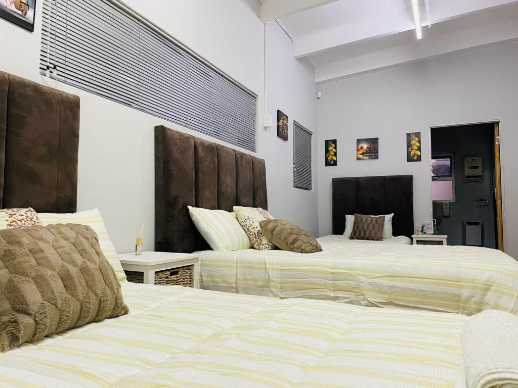 Giường trong phòng chung tại Annikaguesthouse