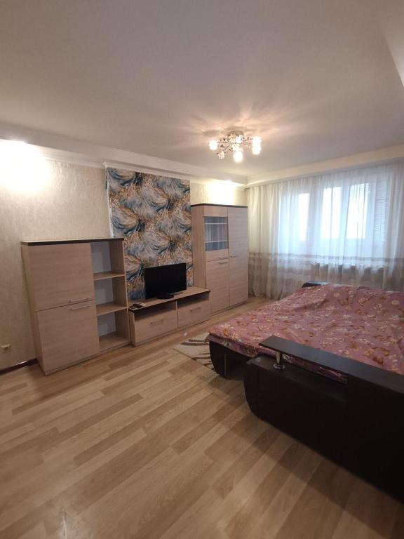 En eller flere senge i et værelse på Здам однокімнатну квартиру