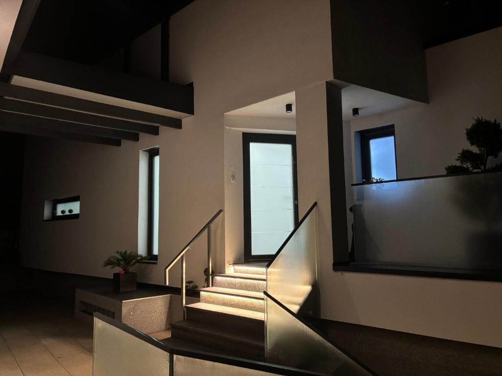 a staircase in a building with a window at Le Cube Strasbourg - Marlenheim in Marlenheim