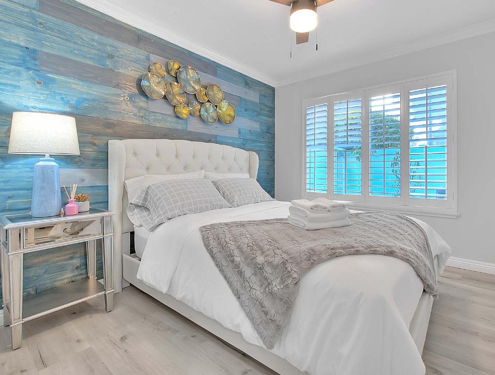 En eller flere senge i et værelse på Arcadia Family House