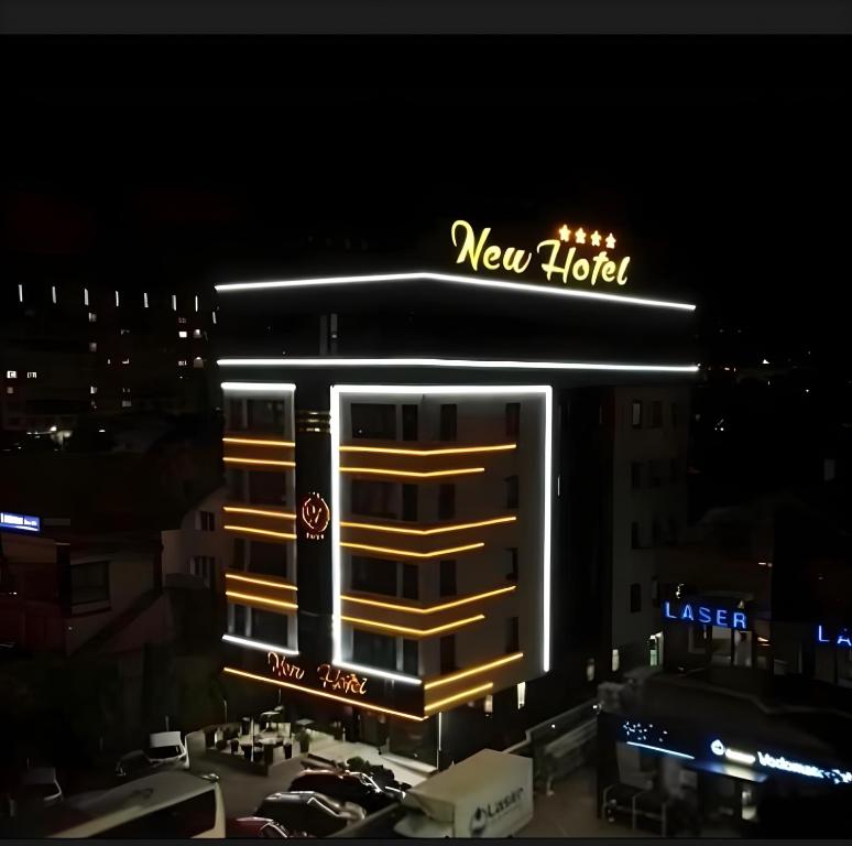 a new york hotel at night with a new hotel sign at New Hotel in Sarajevo
