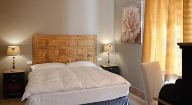 Postel nebo postele na pokoji v ubytování Locanda In Borgo Garnì & Wellness