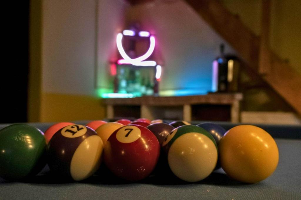 a group of billiard balls on a table at El KINTU WASI in Vicuña