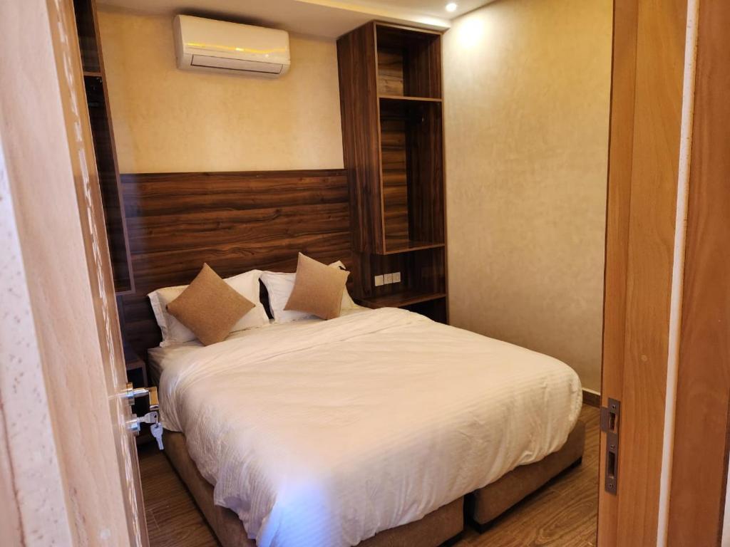 Ένα ή περισσότερα κρεβάτια σε δωμάτιο στο Appartement Aéroport Holiday