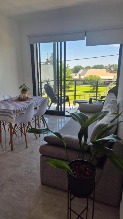 a living room with a couch and a table at MONACO Departamento PA in Federación