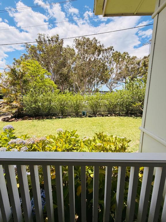 a view of a yard from the porch of a house at Marley's at Boma in Bomaderry