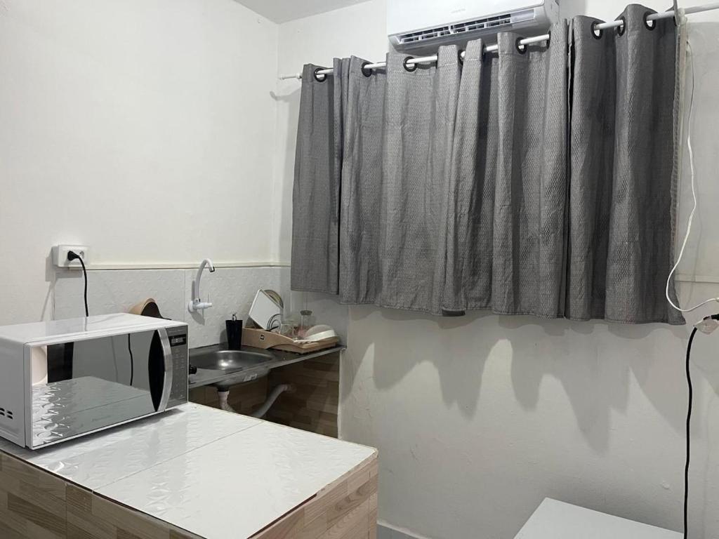 Kuchyň nebo kuchyňský kout v ubytování Espaço central!