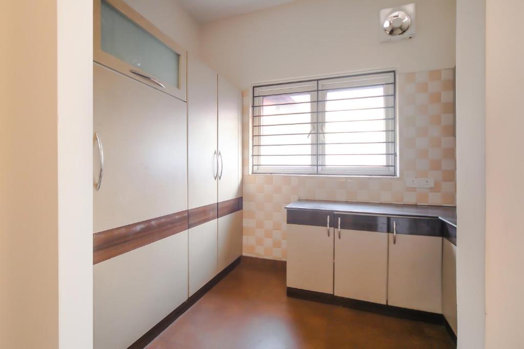 Η κουζίνα ή μικρή κουζίνα στο Super Hotel O Pride Hospitality Nungambakkam