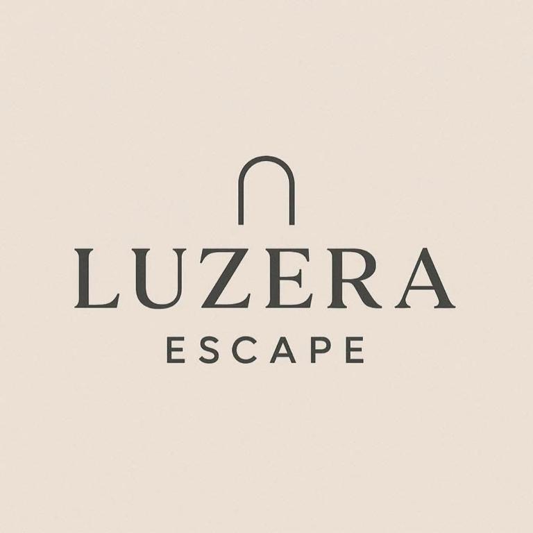 a sign that reads luzer agency at Luzera Escape - a minimalist and cozy studio unit in Davao City