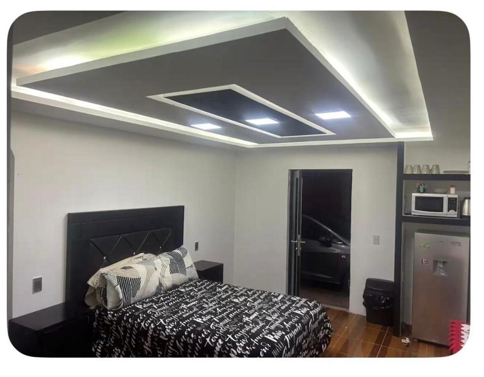 a bedroom with a bed in a room at Apartamento mandarina in Zacatecas