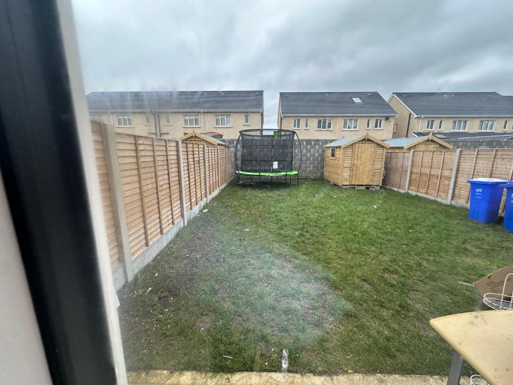 a view from a window of a yard with buildings at Precious Home in Monasterevin