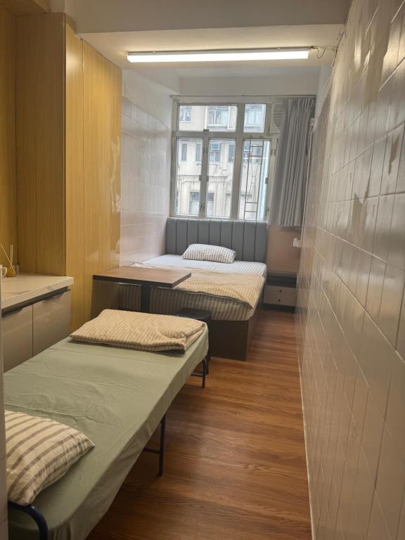 Postel nebo postele na pokoji v ubytování 旅居1号