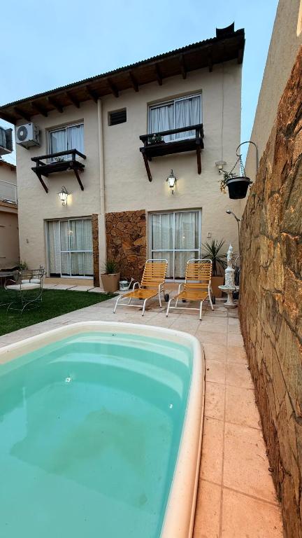 a swimming pool in front of a house at Casa sonia in San Rafael