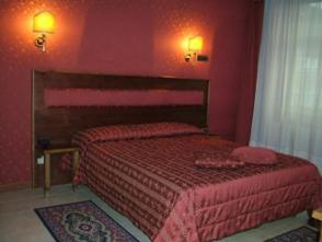 Postel nebo postele na pokoji v ubytování Hotel Shasa