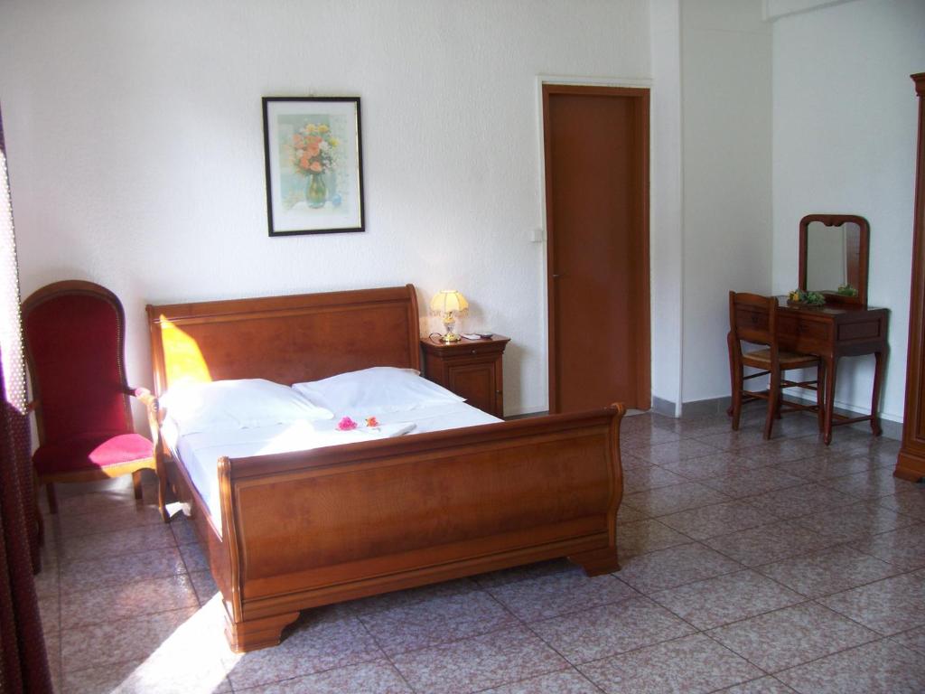 Postel nebo postele na pokoji v ubytování Hôtel Le Nathania
