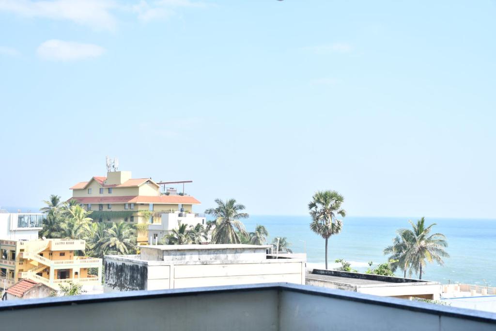 a view of the ocean from the roof of a building at Elegant Beach View Flat , Bheemili in Bhīmunipatnam