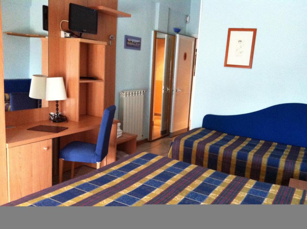 Postel nebo postele na pokoji v ubytování Hotel Morgana