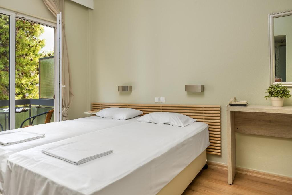 Llit o llits en una habitació de Park Hotel