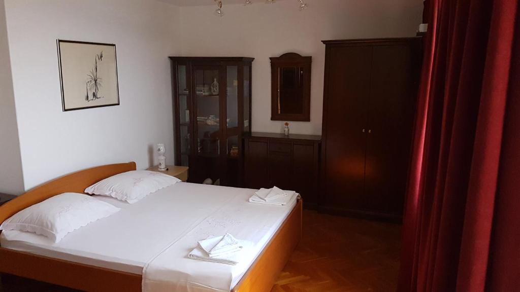 Ένα ή περισσότερα κρεβάτια σε δωμάτιο στο Rooms Vjera