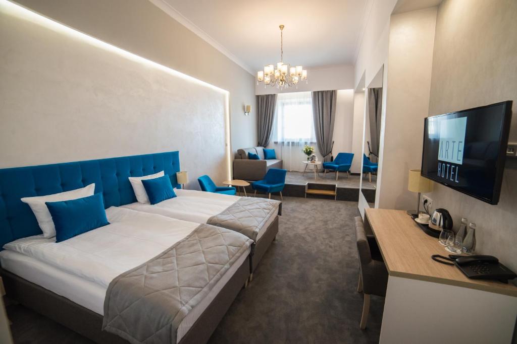 TV a/nebo společenská místnost v ubytování Hotel Arte