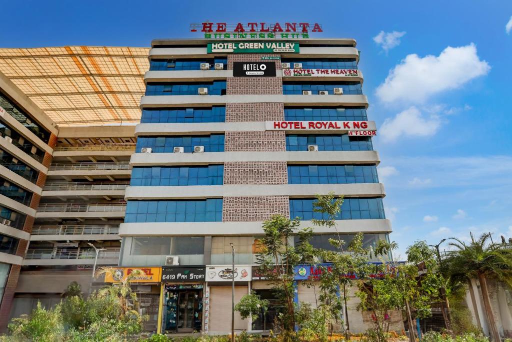a building with a sign on top of it at Super Hotel O Nana Chiloda Near Airport Formerly Green Valley in Ahmedabad