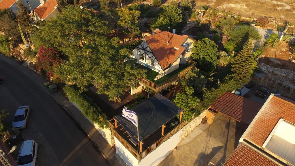 an overhead view of a house with a roof at Villa Billy in Gan Ner