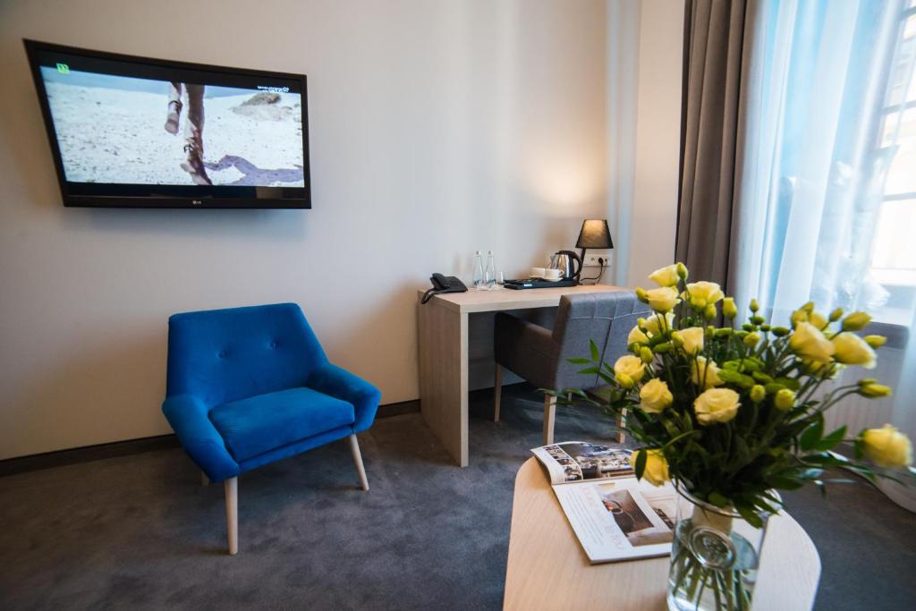 TV a/nebo společenská místnost v ubytování Hotel Arte