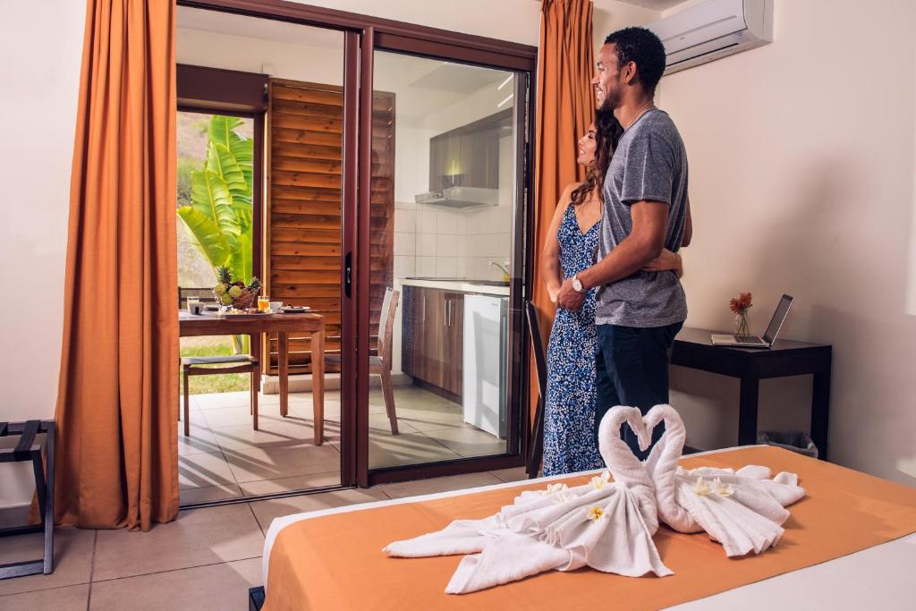 Postel nebo postele na pokoji v ubytování Tama Hotel