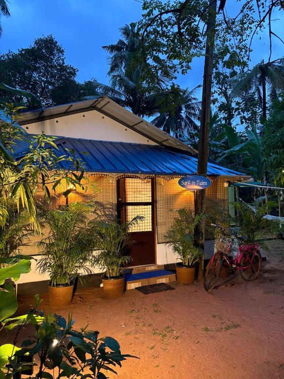 a small house with plants in front of it at SurfN Tides by BHoomiKA in Kappil