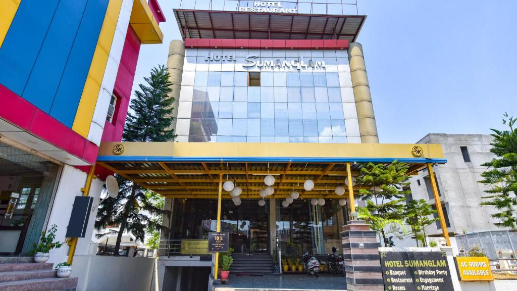 a building with a sign that reads just synergy at Sumanglam in Dehradun