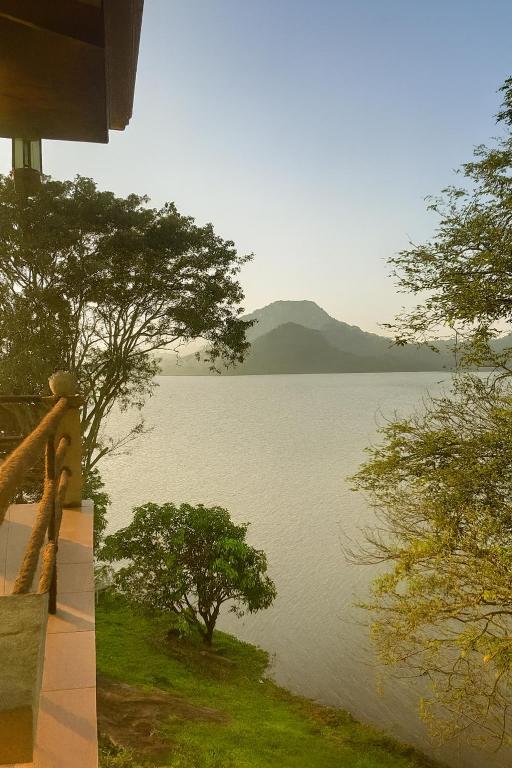a view of a lake from a house at castle palace kandy in Kandy