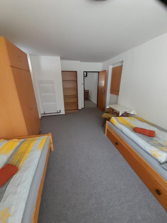 a room with two beds in a room at Apartmán 254 b in Janske Lazne