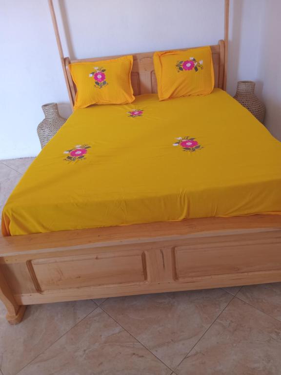 Ένα ή περισσότερα κρεβάτια σε δωμάτιο στο Residence wa maore