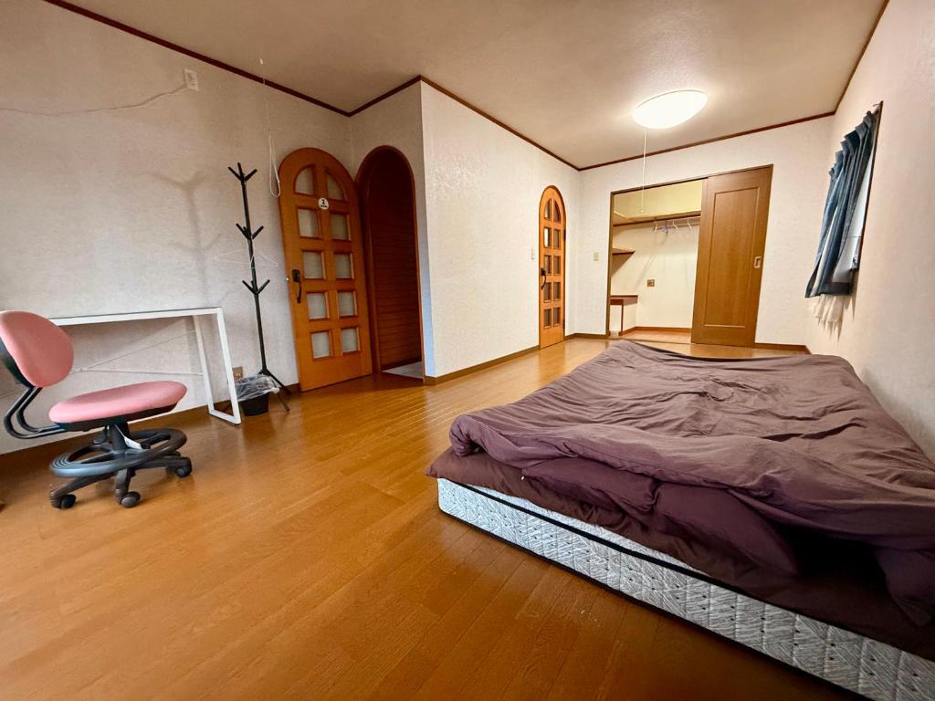 Giường trong phòng chung tại 桜の家