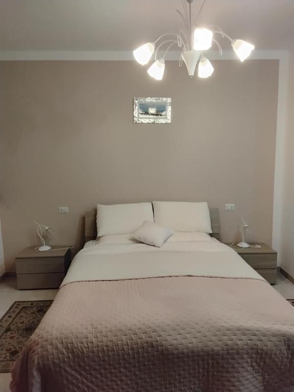 Ένα ή περισσότερα κρεβάτια σε δωμάτιο στο B&B Oasi di pace