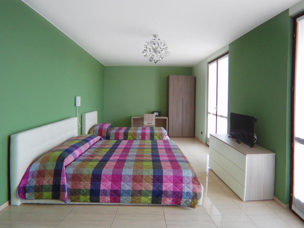 A bed or beds in a room at La Tarantola