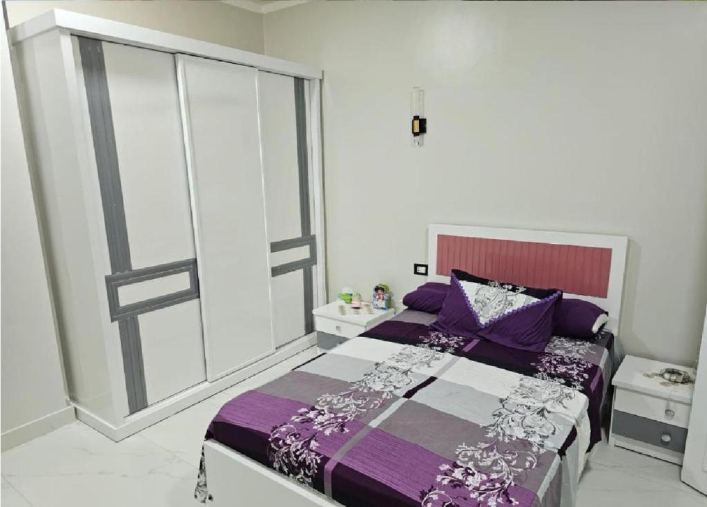 Postel nebo postele na pokoji v ubytování signature house Luxor