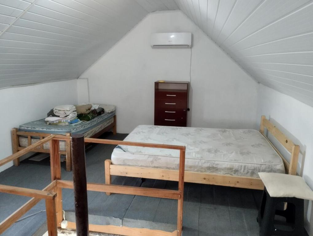 Postel nebo postele na pokoji v ubytování No te pierdas esta linda casa