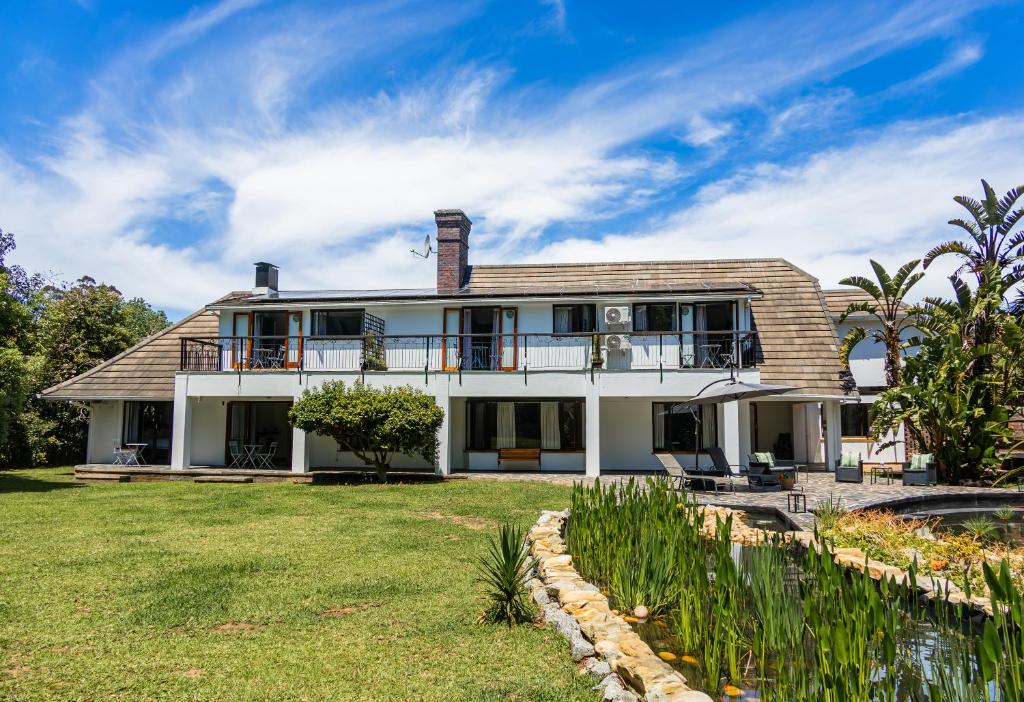 an exterior view of a house with a yard at House 1967 in George