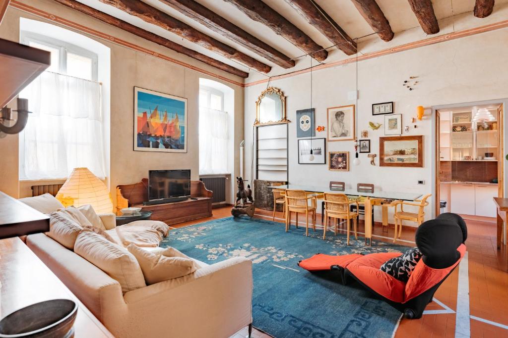 a person laying on the floor in a living room at Carlo Alberto CHARM & TERRACE in Turin