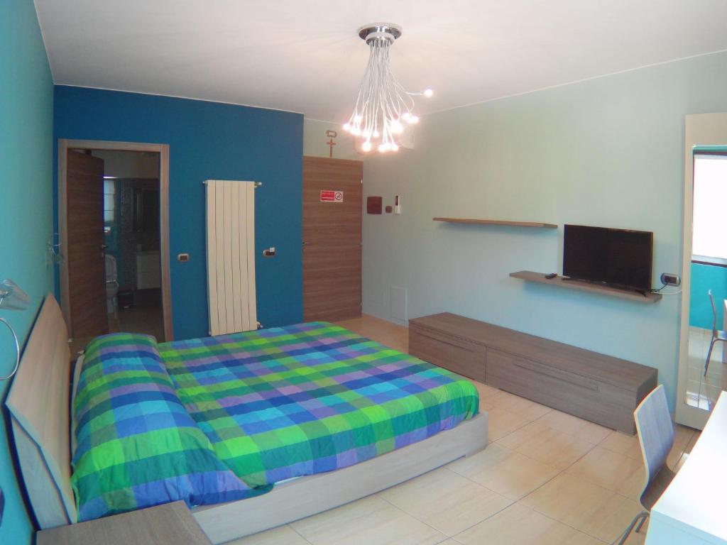 A bed or beds in a room at La Tarantola