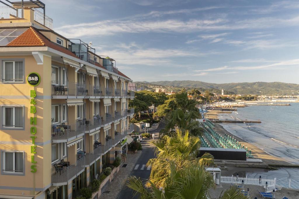 a view of the beach from a building at B&B HOTEL Diano Marina Palace in Diano Marina