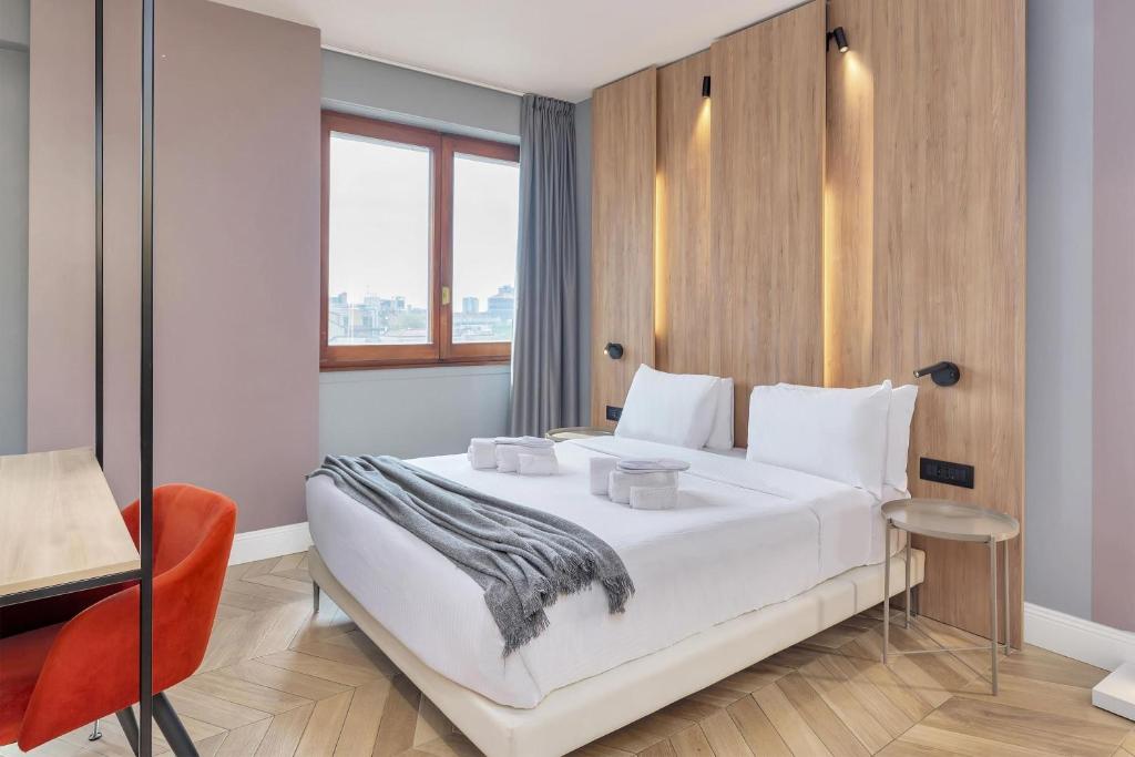 Ένα ή περισσότερα κρεβάτια σε δωμάτιο στο B&B Hotel Milano City Center Duomo