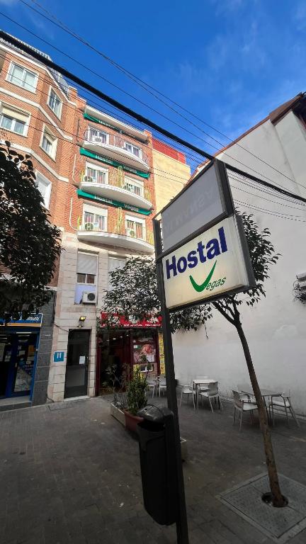a hospital sign in front of a building at Hostal Las Vegas in Madrid