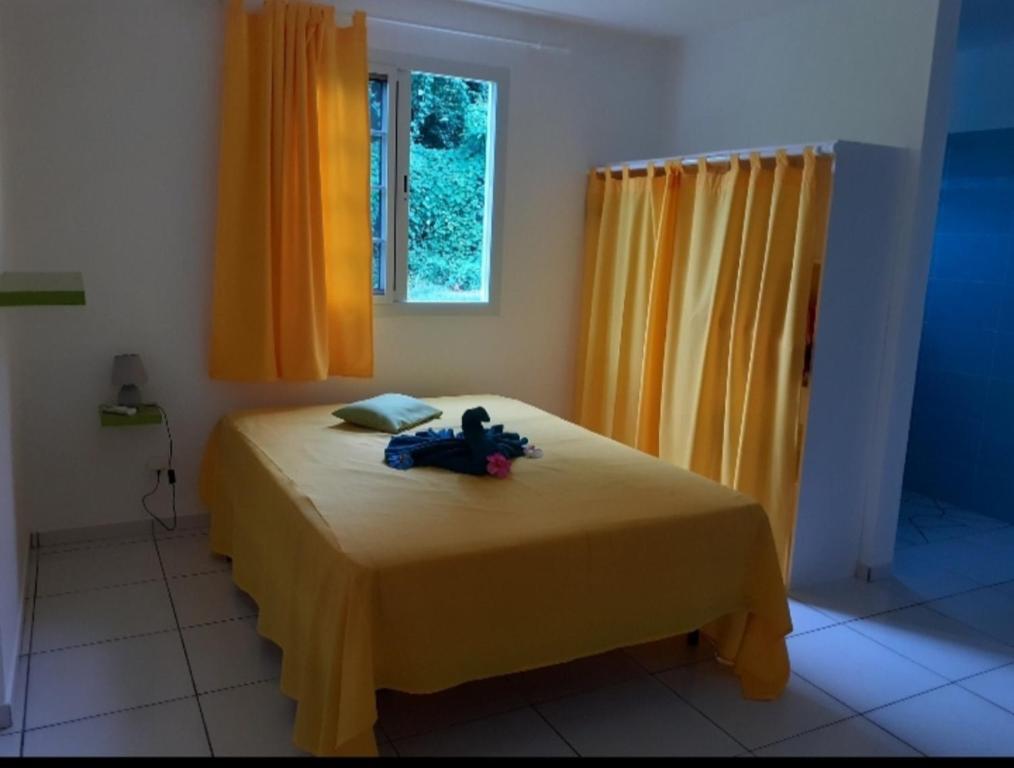 Postel nebo postele na pokoji v ubytování Villa KREOLITA T2