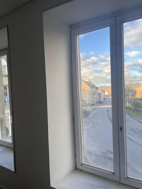 a window with a view of a street at Tinchebray in Tinchebray